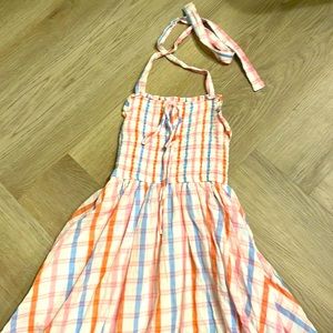 Plaid dress with smocked bodice and halter neck that ties.